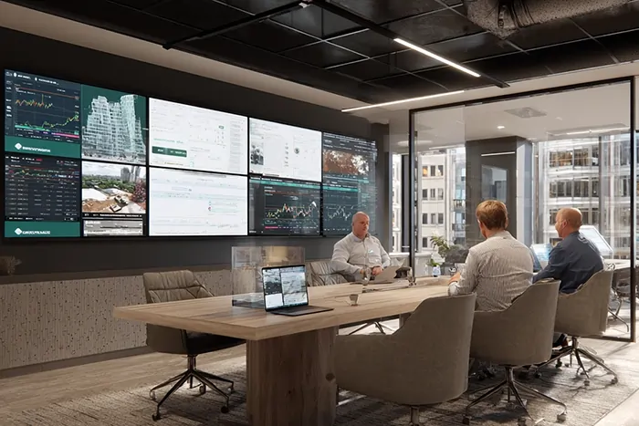 مدیران پروژه در جلسه تحلیل مالی و تهاتر ساختمانی با نمایشگرهای داده و نمودارهای اقتصادی در گروه ساختمانی ساخَط